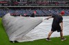 The Progressive Field grounds crew removes a tarp after a rain delay before a baseball game between the Athletics and the Cleveland Guardians, Sunday, Sept. 20, 2026, in Cleveland. (AP Photo/Phil Long)