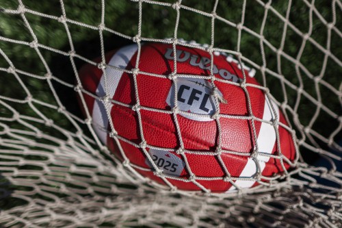 Canadian Football League logo on a football at opening day of CFL training camp in Guelph, Ont., on Sunday, May 11, 2025. THE CANADIAN PRESS/Nick Iwanyshyn