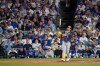 Milwaukee Brewers first baseman Jake Bauers watches his two RBI home run leave the park during the seventh inning of Game 3 of baseball's National League Championship Series between the Milwaukee Brewers and the Los Angeles Dodgers, Wednesday, Oct. 14, 2026, in Los Angeles. (AP Photo/Mark J. Terrill)