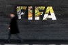 A man walks past a FIFA sign at the headquarters during the FIFA council meeting, in Zurich, Switzerland, Thursday, Oct. 15, 2026. (Claudio Thoma/Keystone via AP)