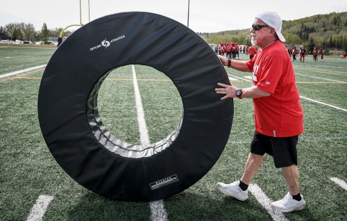 Calgary Stampeders equipment manager George Hopkins moves training gear during the first of training camp in Calgary, Sunday, May 11, 2025. Hopkins has been on the Stampeders staf for over 50 years. THE CANADIAN PRESS/Jeff McIntosh