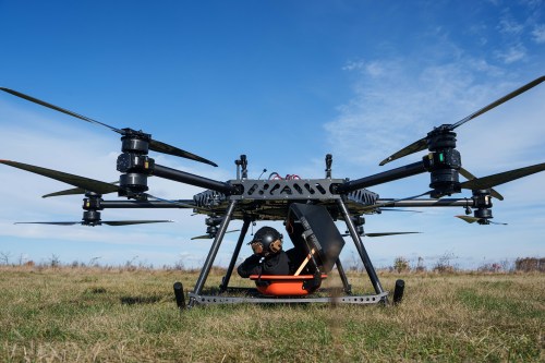 A representative of the SkyFall drone company climbs into a medical module of the SkyGate drone before a demonstration flight at an undisclosed location in Ukraine, Wednesday, Oct. 14, 2026. (AP Photo/Evgeniy Maloletka)