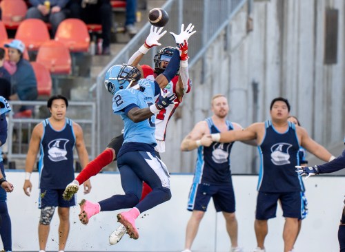 Toronto Argonauts defensive back Tarvarus McFadden (2) battles Ottawa Redblacks wide receiver Nick Mardner (84) for the ball during second half CFL action in Toronto on Saturday October 19, 2024. HE CANADIAN PRESS/Frank Gunn