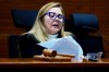 Judge Gloria Canales reads the sentence during the trial of Maickel Villegas, an alleged member of the Tren de Aragua gang accused of kidnapping and murdering former Venezuelan army lieutenant Ronald Ojeda, in Santiago, Chile, Thursday, Oct. 15, 2026. (AP Photo/Esteban Felix)