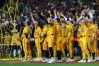 FILE - The Savannah Bananas celebrate their win over the Firefighters during their 
