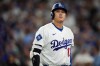 Los Angeles Dodgers designated hitter Shohei Ohtani walks to the dugout after striking out during the seventh inning of Game 4 of baseball's National League Championship Series between the Milwaukee Brewers and the Los Angeles Dodgers, Thursday, Oct. 15, 2026, in Los Angeles. (AP Photo/Gregory Bull)