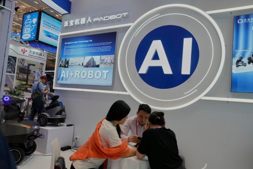 FILE -Vendors for AI enabled robots wait for customers at the 137th Canton Fair in Guangzhou in southern China's Guangdong province on April 16, 2025. (AP Photo/Ng Han Guan, File)