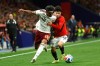 FILE - Spain's Lamine Yamal, left, challenges for the ball with Egypt's Islam Issa during the international friendly soccer match between Spain and Egypt in Barcelona, Spain, Tuesday, March 31, 2026. (AP Photo/Joan Monfort, file)