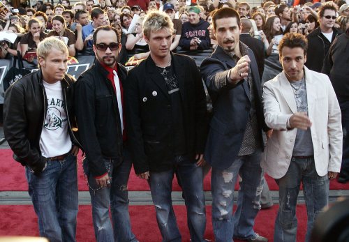Backstreet Boys Brian Littrell (left), AJ McLean, Nick Carter, Kevin Richardson, and Howie Dorough pose for photographers as they arrives at the Much Music Video Awards in Toronto on June 19, 2005.  (CP PHOTO/Tobin Grimshaw)