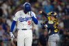 Los Angeles Dodgers first baseman Freddie Freeman walks to the dugout after striking out during the fifth inning of Game 4 of baseball's National League Championship Series between the Milwaukee Brewers and the Los Angeles Dodgers, Thursday, Oct. 15, 2026, in Los Angeles. (AP Photo/Gregory Bull)