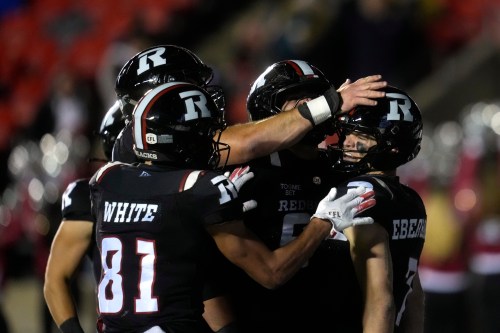 Ottawa Redblacks' Ayden Eberhardt (right) is congratulated by teammates after scoring during second half CFL action against the Toronto Argonauts in Ottawa, Friday, Oct. 16, 2026. THE CANADIAN PRESS/Adrian Wyld