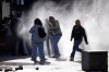 Protesters run from water sprayed by police water cannons during an anti-government demonstration outside the Education Ministry, in Tirana, Albania, Saturday, Oct. 17, 2026. (AP Photo/Hameraldi Agolli)