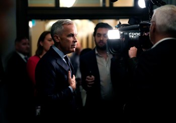 Prime Minister Mark Carney responds to questions from journalists as he arrives on Parliament Hill in Ottawa, before a meeting of the federal cabinet, on Tuesday, Oct. 6, 2026. THE CANADIAN PRESS/Justin Tang
