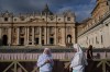 Two nuns arrive in St. Peter's Square at the Vatican for the traditional noon blessing after praying the Angelus with Pope Leo XIV, Sunday, Oct. 18, 2026, a day after he returned from the hospital, where he had lung cancer removed on Tuesday. (AP Photo/Gregorio Borgia)