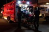 Paramedics load an injured person into an ambulance at the Wainwright Health Centre as injured military members are treated after a fire at CFB Wainwright, outside of Wainwright, Alta., on Saturday, Oct. 17, 2026. THE CANADIAN PRESS/John Ulan