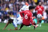 Manchester United's Lisandro Martinez, right, and Leeds United's Dominic Calvert-Lewin battle for the ball during the English Premier League soccer match between Leeds United and Manchester United in Leeds, England, Sunday, Oct. 18, 2026. (Annabel Lee-Ellis/PA via AP)