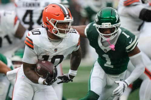 Cleveland Browns running back Quinshon Judkins (10) runs from New York Jets cornerback Azareye'h Thomas (1) during the first half of an NFL football game, Sunday, Oct. 11, 2026, in East Rutherford, N.J. (AP Photo/Seth Wenig)