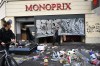 A man walks past a looted store the day after a demonstration against rising living costs and in solidarity with students’ grievances, in Paris, Sunday, Oct. 18, 2026. (AP Photo/Emma Da Silva)