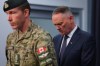 National Defence Minister David McGuinty, right, and Major-General L.W. Rutland attend a press conference in Edmonton, Sunday, Oct. 18, 2026. THE CANADIAN PRESS/James Maclennan