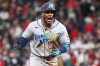 Tampa Bay Rays' Yandy Díaz celebrates a two-run home run against the Cleveland Guardians during the ninth inning in Game 4 of an American League Championship Series baseball game in Cleveland, Saturday, Oct. 17, 2026. (AP Photo/Phil Long)