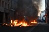 Trash burns during clashes between protestors and police officers during a demonstration against rising living costs, joining students' grievances, in Paris, Sunday, Oct. 18, 2026. (AP Photo/Emma Da Silva)