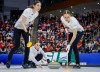 Switzerland's skip Xenia Schwaller, centre, delivers a stone against Team Canada as lead Selina Rychiger, left, and third Selina Gafner sweep during the final at the world women’s curling championship in Calgary on March 22, 2026.  THE CANADIAN PRESS/Jeff McIntosh