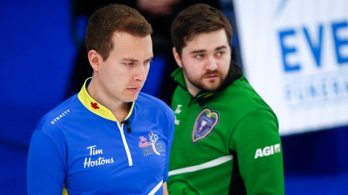 Team Alberta skip Brendan Bottcher, right, contemplates a shot as Team Saskatchewan skip Matt Dunstone looks on during the semifinal at the Canadian men's curling championship in Calgary on March 14, 2021.THE CANADIAN PRESS/Jeff McIntosh