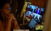 A translator looks on during a news conference in Ottawa on Saturday, Nov. 21, 2020. THE CANADIAN PRESS/Justin Tang