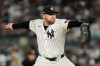 New York Yankees pitcher David Bednar throws to the Tampa Bay Rays during the eighth inning in Game 3 of baseball's American League Division Series, Wednesday, Oct. 7, 2026, in New York. (AP Photo/Seth Wenig)