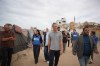 World Food Programme Executive Director Carl Skau, center, visits a camp for displaced Palestinians in Deir al-Balah, central Gaza Strip, Sunday, Oct. 18, 2026. (AP Photo/Abdel Kareem Hana)