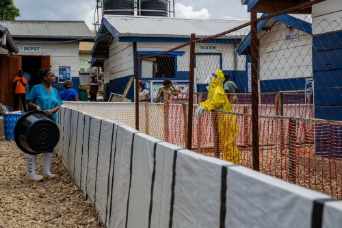 A healthcare worker speaks to a colleague at the Ebola treatment center in Beni, North Kivu province, Congo, Monday, Oct. 19, 2026. (AP Photo/Sebastien Kitsa Musayi)