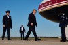 FILE - President Donald Trump walks from Marine One to board Air Force One, Monday, Oct. 19, 2026, at Joint Base Andrews, Md., with Col. Melissa Dombrock, deputy commander of the 89th Airlift Wing, left. (AP Photo/Julia Demaree Nikhinson, File)