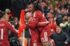Liverpool's Alexis Mac Allister, centre, celebrates with Liverpool's Rio Ngumoha after scoring his side's third goal during the Champions League opening phase soccer match between Liverpool and Villarreal in Liverpool, England, Tuesday, Oct. 20, 2026. (AP Photo/Ian Hodgson)