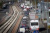 Trucks are parked along the street during a truckers' protest in Naples, Italy, over high fuel prices, Tuesday, Oct. 20, 2026. (Alessandro Garofalo/LaPresse via AP)