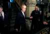 Prime Minister Mark Carney speaks with journalists as he makes his way into a meeting of the Liberal caucus on Parliament Hill on Wednesday, Oct. 21, 2026. THE CANADIAN PRESS/Justin Tang