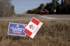 Political signs are posted on a rural road in Wainwright, Alta., on Monday, Oct. 19, 2026. (AP Photo/Ty O'Neil)