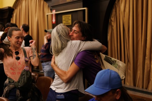 Leigh Carroll, right, embraces Jean Stone after a paid parental leave bill passes Allegheny County Council at the Allegheny County Courthouse in Pittsburgh, Tuesday, Oct. 20, 2026. (Danny Arensberg/Pittsburgh's Public Source)