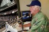 FILE - Milwaukee Brewers' radio announcer Bob Uecker works out of the radio booth during a baseball game against the Pittsburgh Pirates, July 7, 2003, at Miller Park in Milwaukee. (AP Photo/Morry Gash, File)