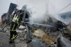 Firefighters try to extinguish a fire after a Russian missile attack in central Kyiv, Ukraine, Thursday, Oct. 22, 2026. (AP Photo/Efrem Lukatsky)