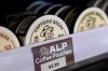 Containers of caffeine pouches, small packets placed in the mouth between the lip and gum, are on display at Red Star Vapor Smoke in Flagstaff, Ariz., on Tuesday, Oct. 13, 2026. (AP Photo/Cheyanne Mumphrey)