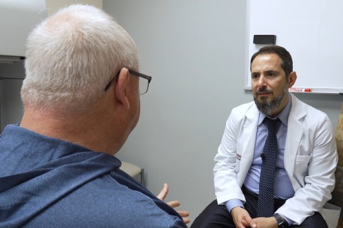 In this image made from video, Tony Hout, left, talks with Dr. Hussein Tawbi at UT MD Anderson Cancer Center in Houston, Monday, Oct. 19, 2026. (AP Photo/Lekan Oyekanmi)