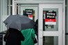 People walk into a polling station to vote on election day in Vancouver, on Saturday, Oct. 19, 2024. THE CANADIAN PRESS/Ethan Cairns