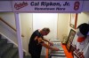 Baltimore Orioles fan Rick Taylor looks through his collection of tickets from almost every baseball game of Cal Ripken Jr.'s 2,632 game 