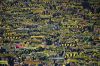 Borussia Dortmund's fans hold up their team scarfs prior to the start of the German Bundesliga soccer match between Borussia Dortmund and Werder Bremen in Dortmund, Germany, Friday, Oct. 9, 2026. (AP Photo/Martin Meissner)
