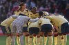 Arsenal team huddles just prior to kick off of the English Premier League soccer match between Nottingham Forest and Arsenal in Nottingham, England, Sunday, Oct. 18, 2026. (AP Photo/Maddy Grassy)