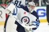 Winnipeg Jets goaltender Connor Hellebuyck makes a save against the Dallas Stars in the first period of Game 6 of a second-round NHL playoff series in Dallas on Saturday, May 17, 2025. (AP Photo/Gareth Patterson)