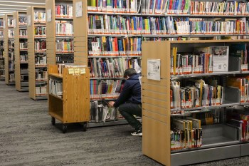 Books line shelves at the North York Central Library in Toronto on Friday, Feb. 23, 2024. THE CANADIAN PRESS/Chris Young