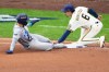 Tampa Bay Rays' Victor Mesa Jr. is tagged out stealing by Milwaukee Brewers third baseman David Hamilton during the fifth inning of Game 1 of baseball's World Series, Friday, Oct. 23, 2026, in Milwaukee, between the Milwaukee Brewers and the Tampa Bay Rays. (AP Photo/David J. Phillip)