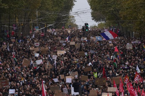 Protesters march during a demonstration against rising living costs in Paris, Saturday, Oct. 24, 2026. (AP Photo/Thibault Camus)