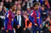 Barcelona's Lamine Yamal, right, and Barcelona's Alejandro Balde react at the end of the Spanish La Liga soccer match between FC Barcelona and Real Madrid in Barcelona, Spain, Sunday, Oct. 25, 2026. (AP Photo/Jose Breton)